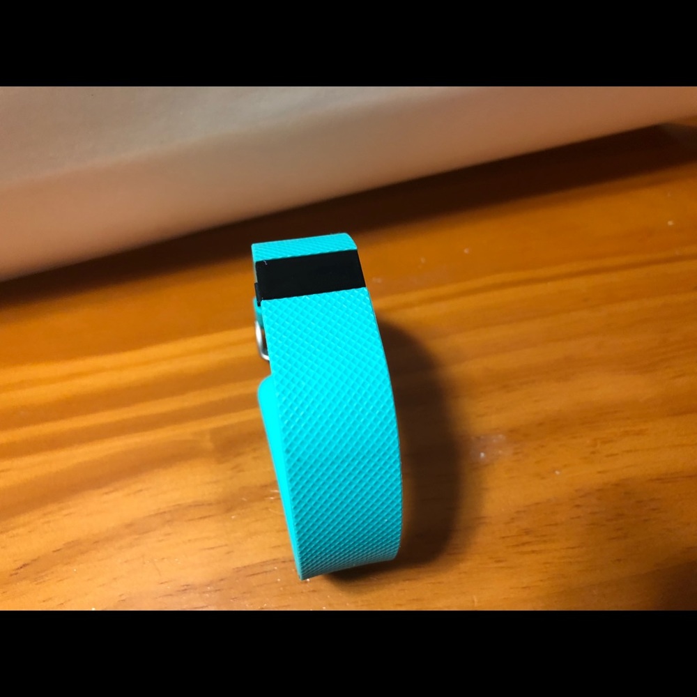 FItBit HR in teal color. unisex.